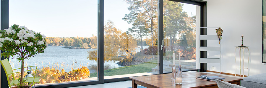 Beautiful view of a blue lake captured from the inside of a villa